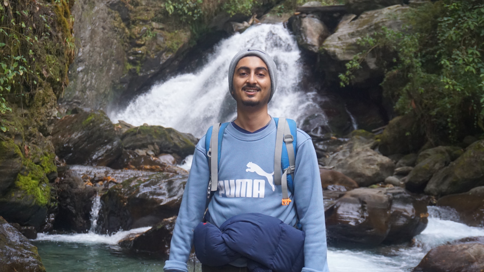 Utsav at waterfall during trek
